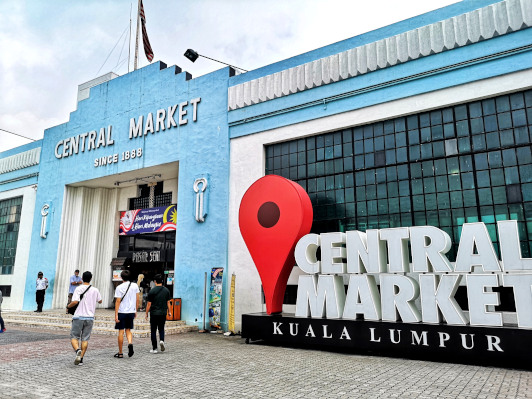 Central Market Drop Pin, next to the entrance of the iconic blue facade