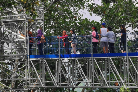 Visitors are waiting for their turnm to climb up to the highest tower