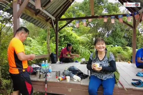 Having coffee at the summit of Gunung Angsi