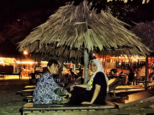 Sitting at the gazebo along the beach at night.