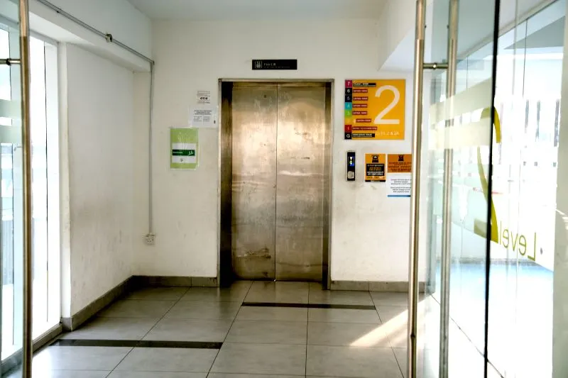 the multi-level parking lot on the left in front of the entrance. of the lower station.