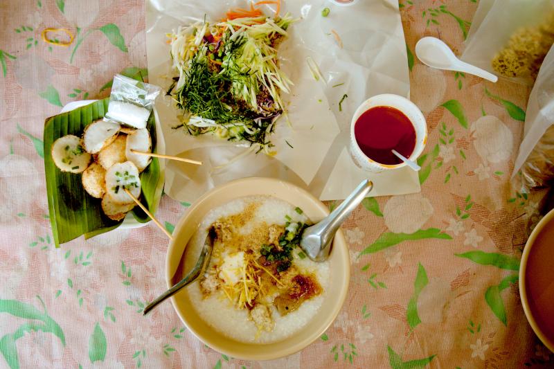 (Clockwise from top: nasi kerabu (Khao Yam),pork porridge,local apam (Khanom krok) Kim Yog Market