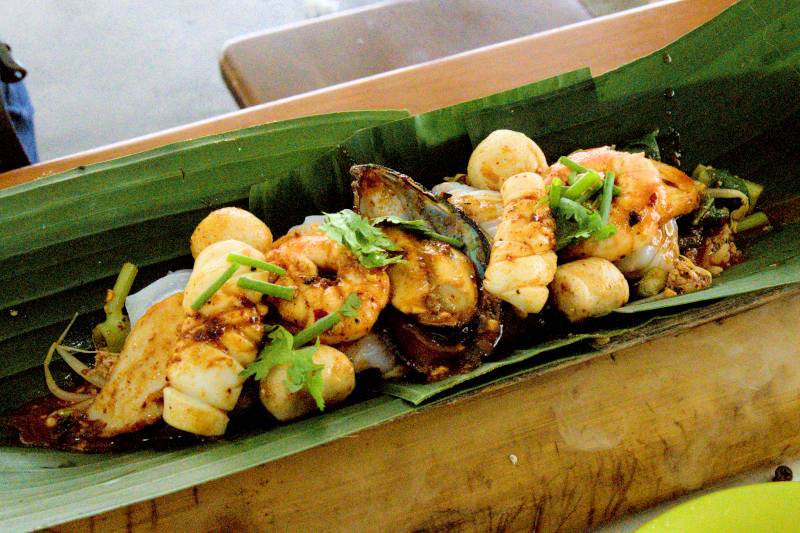 seafood platter served on top of a large bamboo, Pakmornalo Naisuan