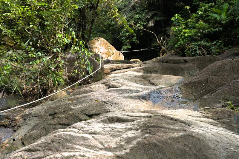 Trekking Through the Dense Rainforest to Lembibg rainbow waterfall