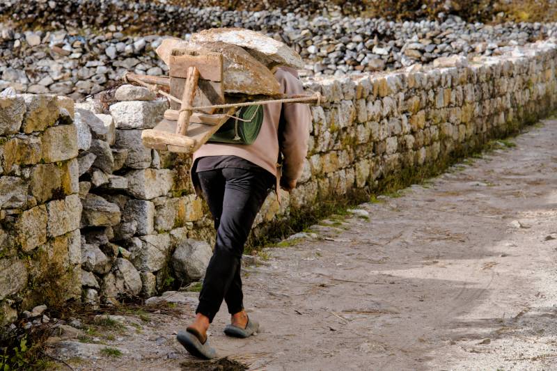On the way back, I saw a local man carrying slabs of stone. Life is tough.