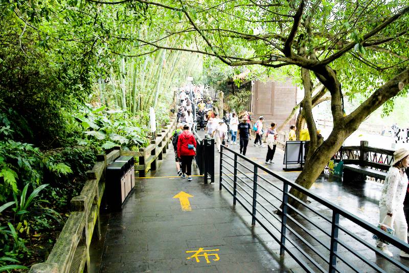 Walking along the platform of Huangguoshu Waterfall.
