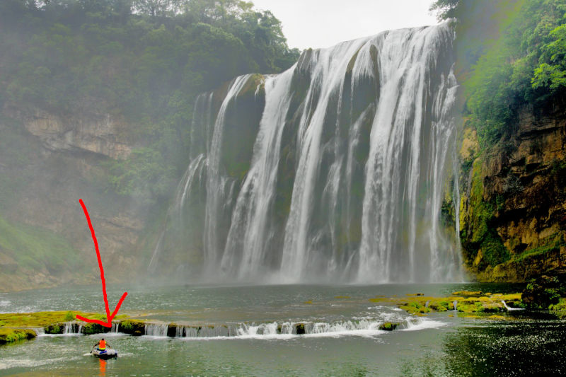 I captured a photo with a small boat in the frame, which helps show the scale and grandeur of the waterfall.
