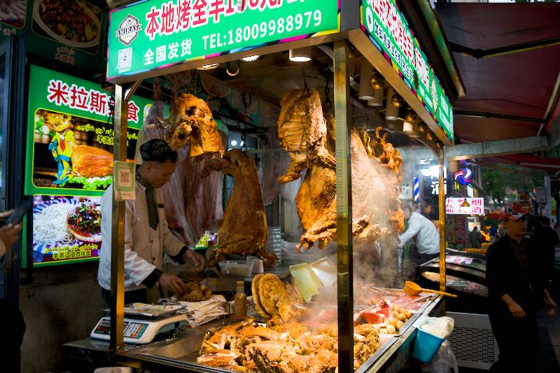Enjoying roast whole lamb at 米拉斯本地烤全羊.