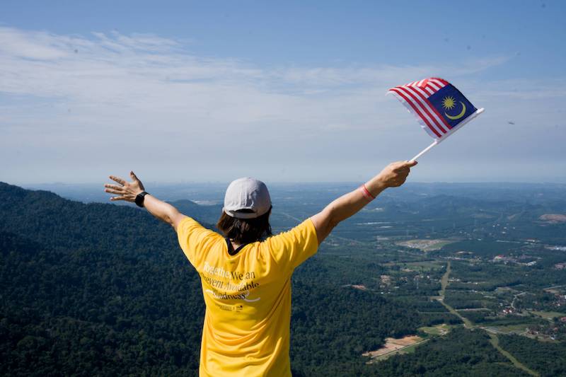 Celebrating National Day of Malaysia on top of Gunung Datuk